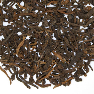 A close-up image of Oracle puer tea leaves.