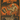 Vintage Halloween tea label for TeaSource Bucket Kicker Black Tea, featuring a mustached mummy kicking a metal bucket in a spooky graveyard beneath an orange moon, with cobwebs, spiders, and distressed orange-and-black artwork.