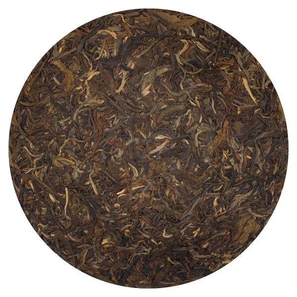 Unwrapped Tiger Hunter Raw Puer Tea Cake