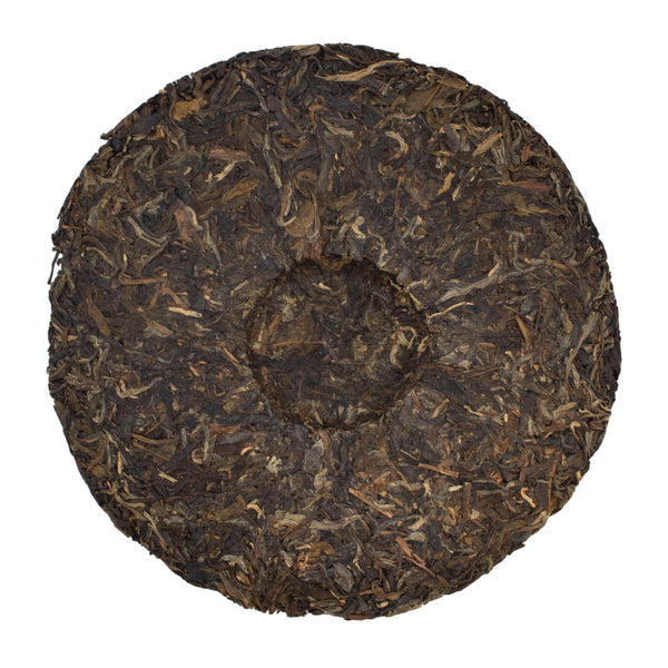 The Edge of the World raw puer tea cake