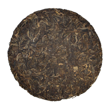 The Edge of the World raw puer tea cake