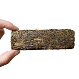 Side view compressed Fu Cha Dark tea brick